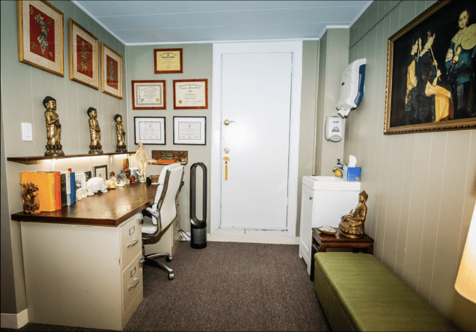 Interior Image of Upper West Side Acupuncture Clinic - Image contains Certificate and 3 buddha sculpture