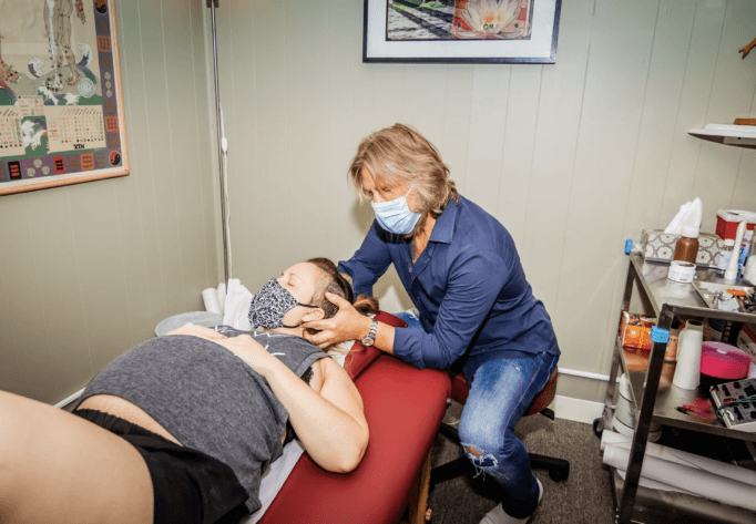 Dr. Phil Adjusting Neck of Patient at his Upper West Side Acupuncture Clinic