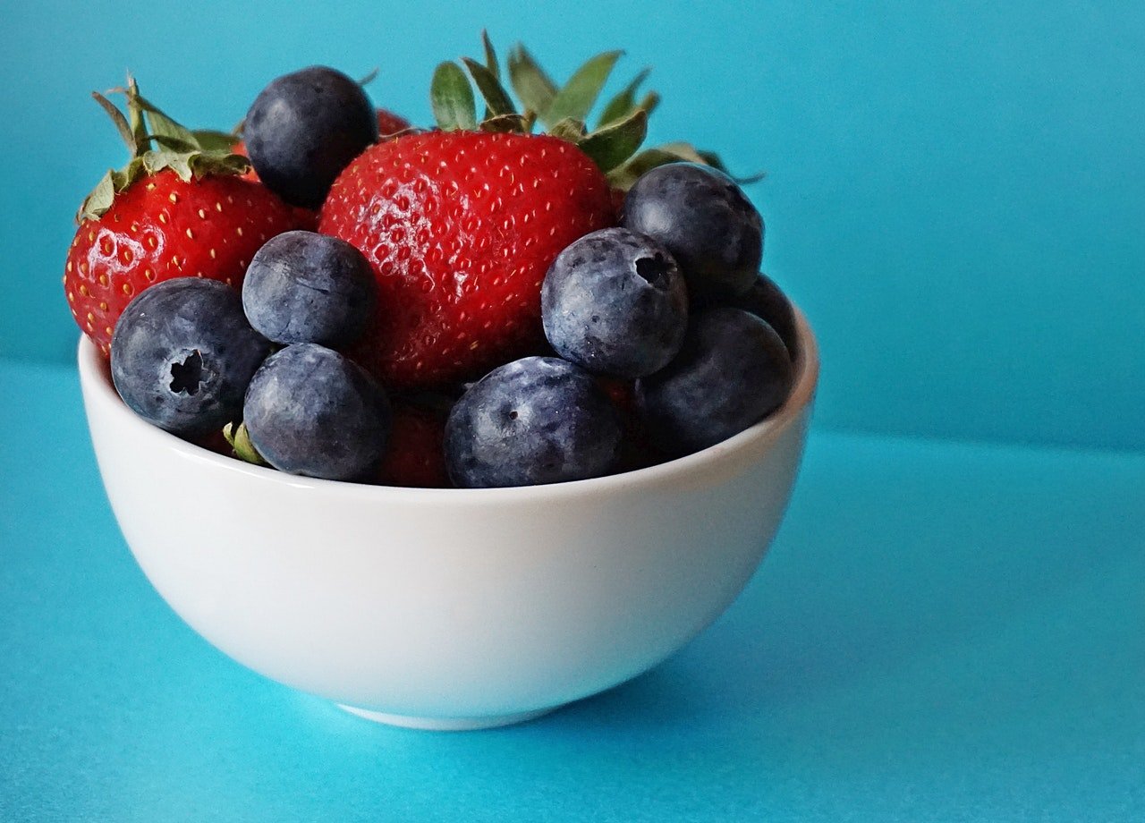 A bowl of fruits - Strawberries and blue berries